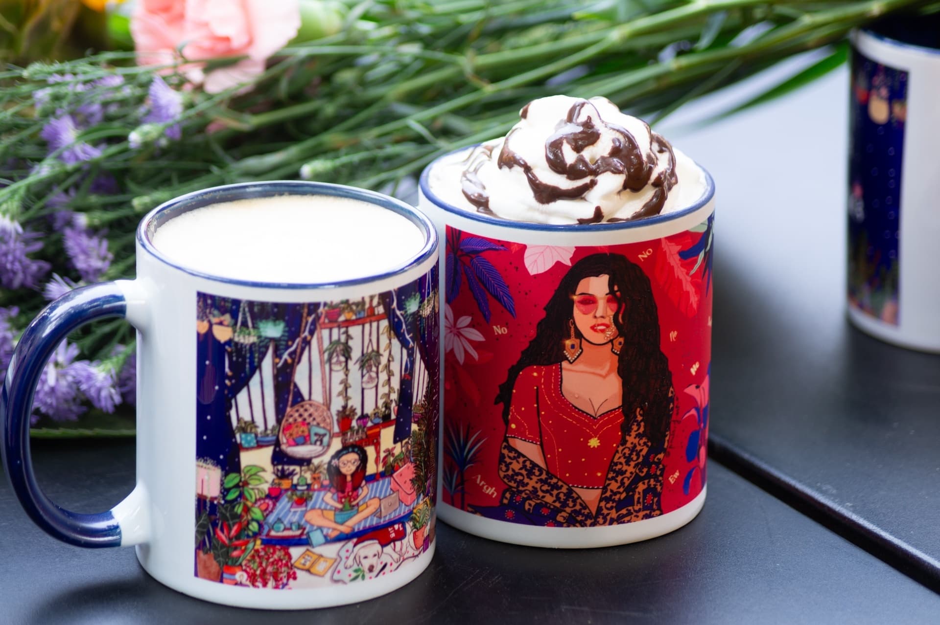 Two illustrated mugs side by side, one filled with milky tea and the other topped with whipped cream and chocolate drizzle